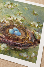 Unframed Nest poster detail showing blue eggs, a bird nest and white blossoms, illustrative close-up.